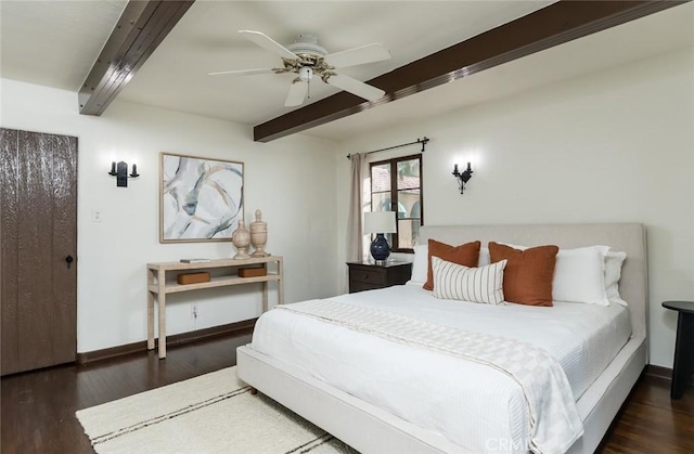 bedroom with beam ceiling, wood finished floors, baseboards, and a ceiling fan