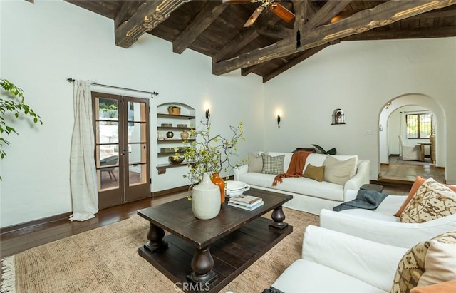 living area with arched walkways, wood finished floors, ceiling fan, french doors, and wood ceiling