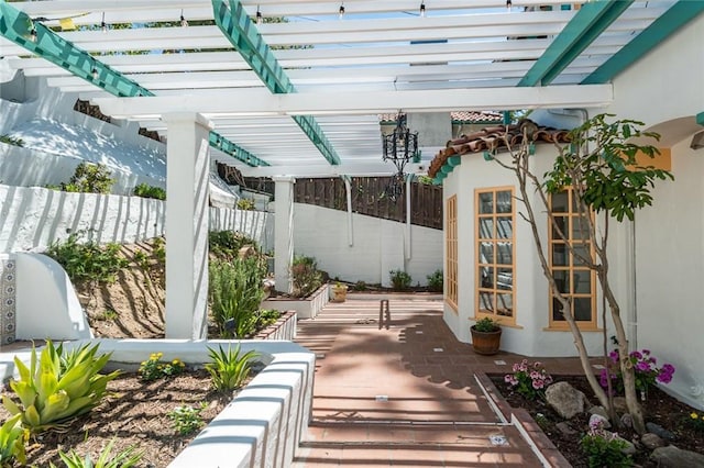 view of patio / terrace featuring a pergola and fence