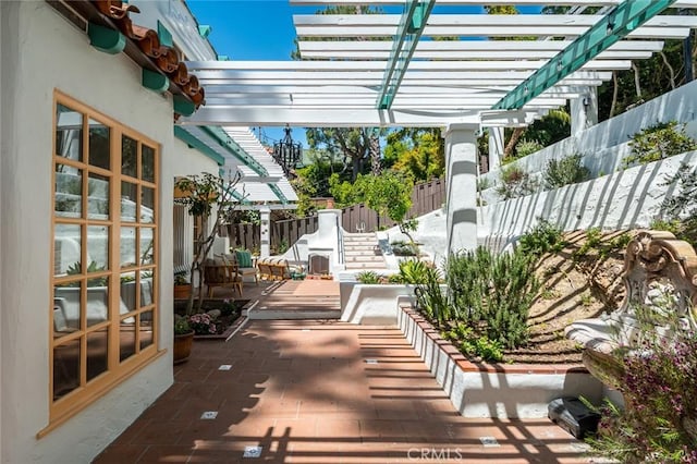 view of patio / terrace featuring a fenced backyard and a pergola
