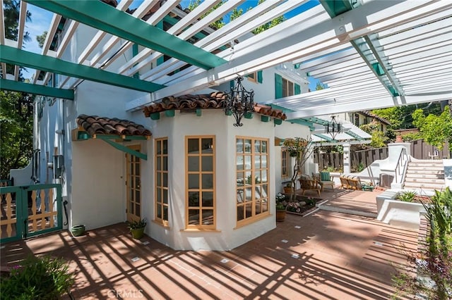 view of patio / terrace featuring a pergola and fence