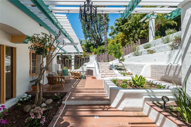 view of patio / terrace with a pergola and a fenced backyard