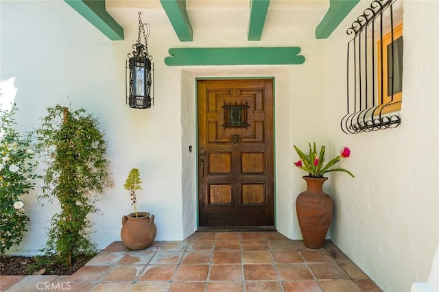entrance to property with stucco siding