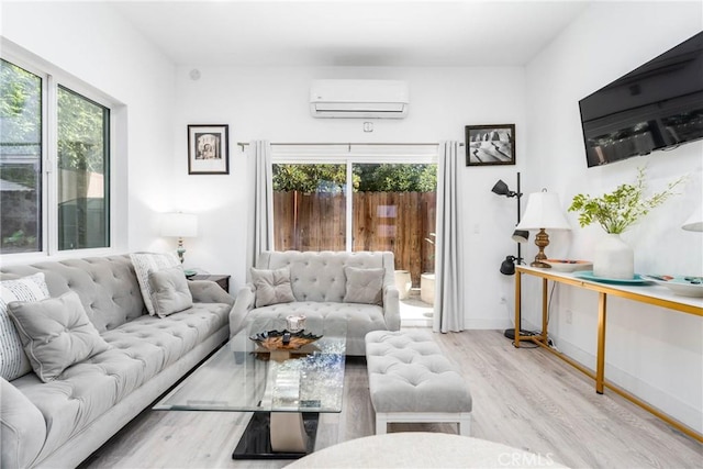 14027 Wyandotte St, Van Nuys, CA 91405 - living room with a wall mounted air conditioner, wood finished floors, plenty of natural light, and baseboards