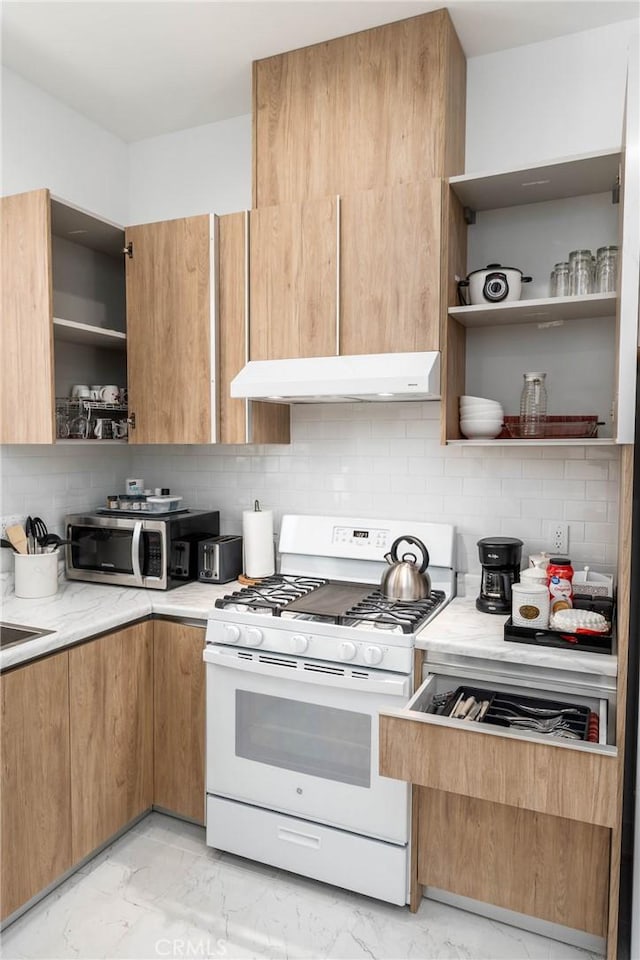 14027 Wyandotte St, Van Nuys, CA 91405 - kitchen with open shelves, white range with gas stovetop, light marble finish floors, stainless steel microwave, and decorative backsplash