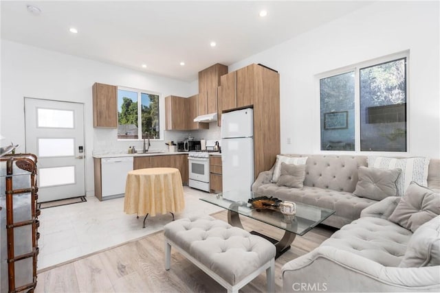 14027 Wyandotte St, Van Nuys, CA 91405 - living room with recessed lighting and light wood finished floors