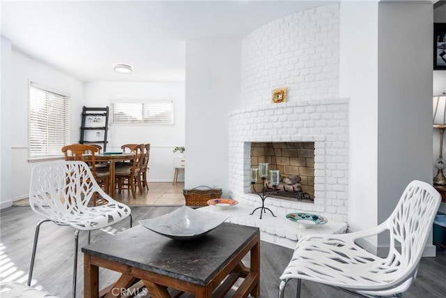 14027 Wyandotte St, Van Nuys, CA 91405 - living room with baseboards, a fireplace, and wood finished floors