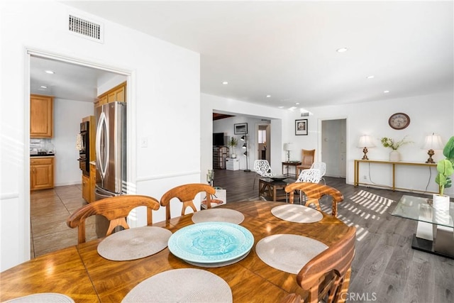 14027 Wyandotte St, Van Nuys, CA 91405 - dining area featuring recessed lighting and light wood-style flooring