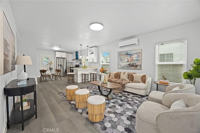 2461 Saint Pierre Ave, Altadena, CA 91001 - living room with a wall unit AC, wood finished floors, and plenty of natural light