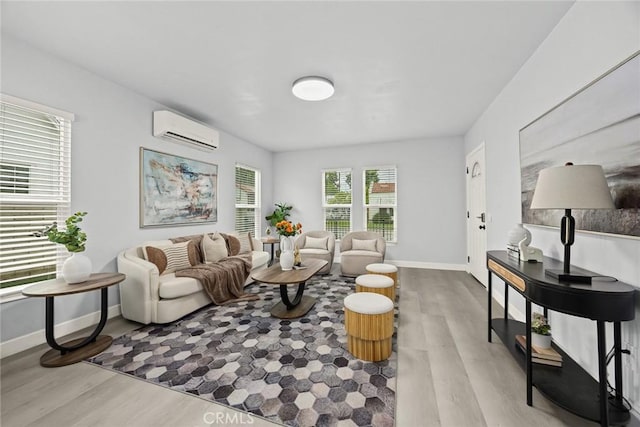 2461 Saint Pierre Ave, Altadena, CA 91001 - living room featuring a wall mounted air conditioner, wood finished floors, and baseboards