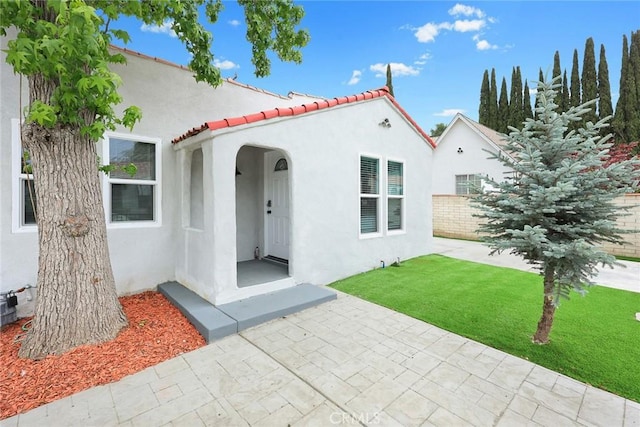2461 Saint Pierre Ave, Altadena, CA 91001 - view of front of property with stucco siding, a tile roof, and a patio