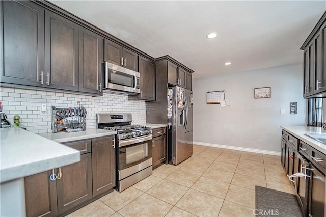824 S Fenimore Ave, Covina, CA 91723 - kitchen featuring appliances with stainless steel finishes, decorative backsplash, baseboards, recessed lighting, and dark brown cabinets