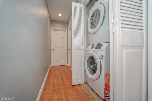 824 S Fenimore Ave, Covina, CA 91723 - laundry room with stacked washer / dryer, baseboards, light wood-style flooring, and recessed lighting