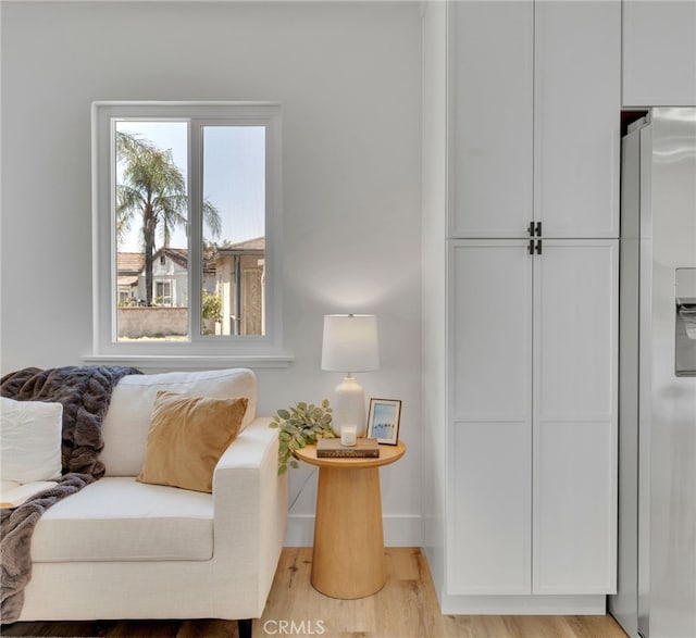 8332 Cherimoya Ave, Fontana, CA 92335 - living area with light wood-type flooring and baseboards