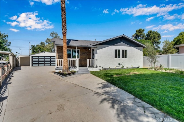 8332 Cherimoya Ave, Fontana, CA 92335 - view of front of property with stucco siding, a detached garage, and a porch