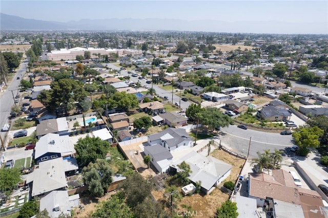 8332 Cherimoya Ave, Fontana, CA 92335 - aerial view of property's location with a mountain backdrop and nearby suburban area