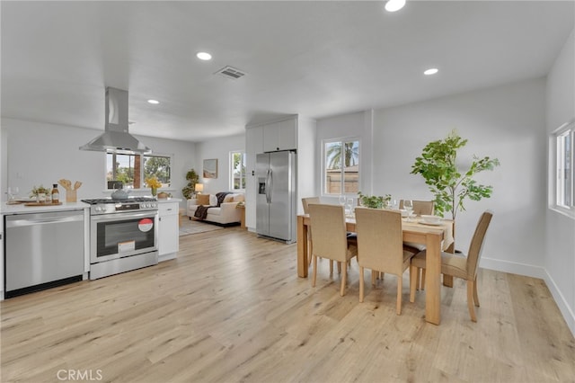 8332 Cherimoya Ave, Fontana, CA 92335 - dining room with plenty of natural light, light wood-style floors, recessed lighting, and baseboards