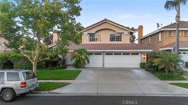 1551 Dominguez Ranch Rd, Corona, CA 92882 - view of front of home featuring a tiled roof, concrete driveway, stucco siding, an attached garage, and a front lawn
