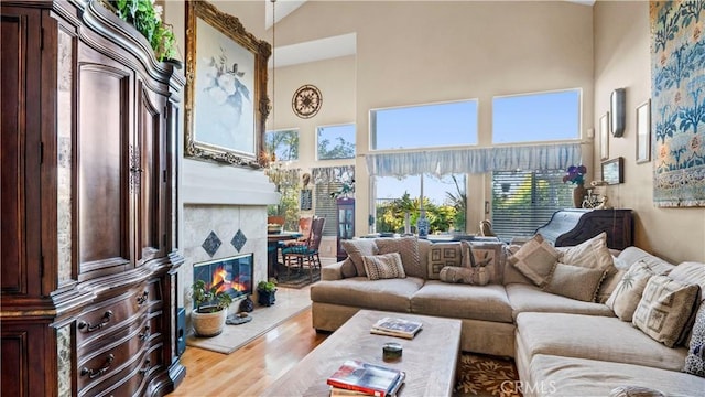 1551 Dominguez Ranch Rd, Corona, CA 92882 - living room with a towering ceiling, wood finished floors, and a fireplace