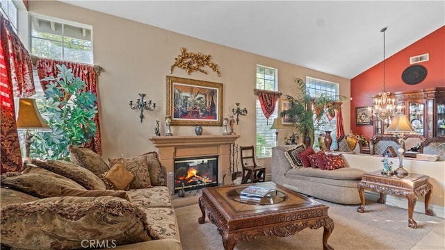 1551 Dominguez Ranch Rd, Corona, CA 92882 - living area featuring healthy amount of natural light, a chandelier, high vaulted ceiling, and a glass covered fireplace