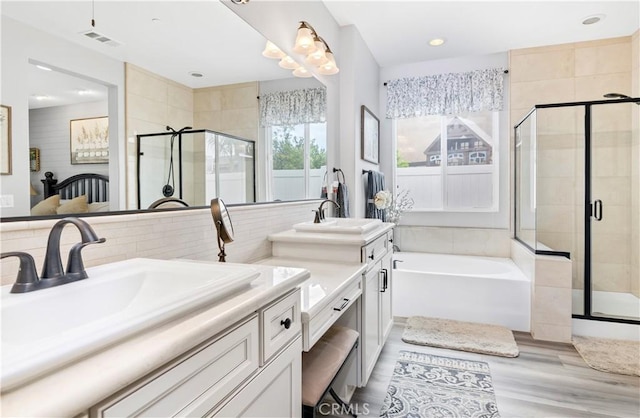 25303 Water Wheel Ct, Menifee, CA 92584 - bathroom with double vanity, a stall shower, a bath, tasteful backsplash, and recessed lighting