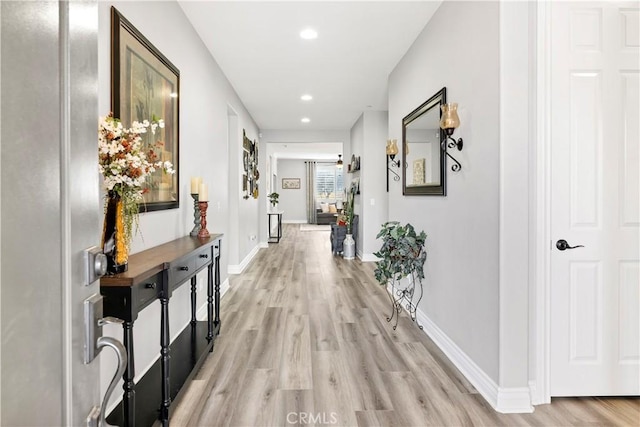 25303 Water Wheel Ct, Menifee, CA 92584 - corridor with light wood finished floors, recessed lighting, and baseboards