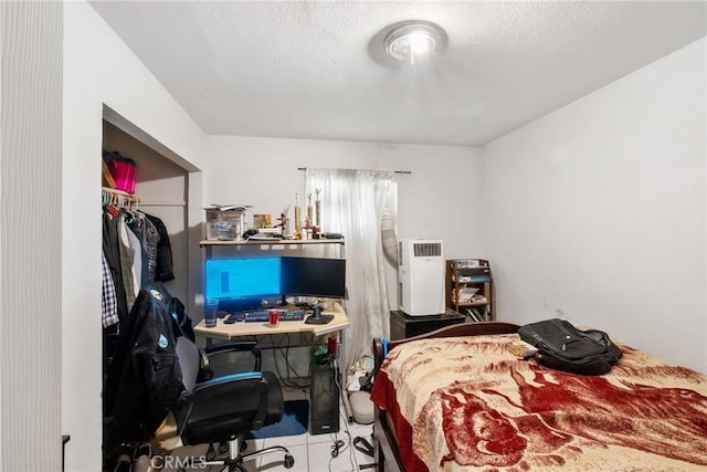 260 Pierce Ave, Barstow, CA 92311 - tiled bedroom with an office area and a closet