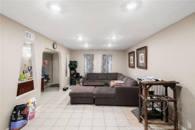 260 Pierce Ave, Barstow, CA 92311 - living room with light tile patterned floors, arched walkways, and recessed lighting