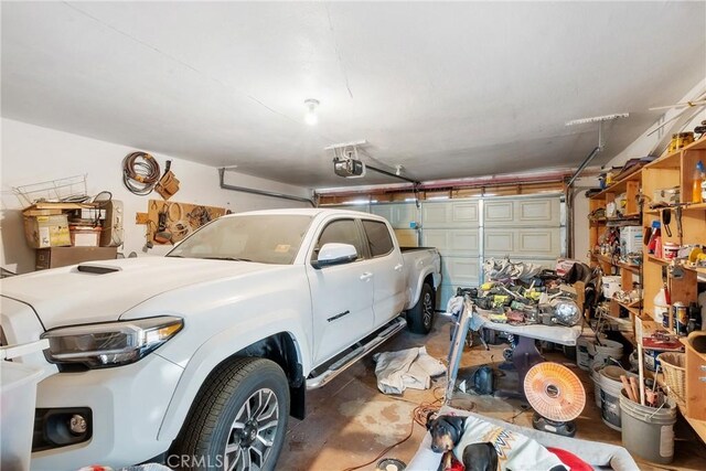 260 Pierce Ave, Barstow, CA 92311 - garage featuring a garage door opener