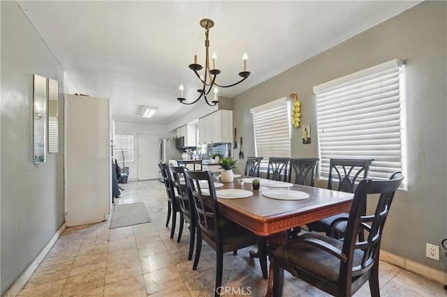12737 Cometa Ave, San Fernando, CA 91340 - dining space with a chandelier and baseboards