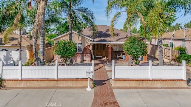 12737 Cometa Ave, San Fernando, CA 91340 - view of front facade with a fenced front yard and brick siding