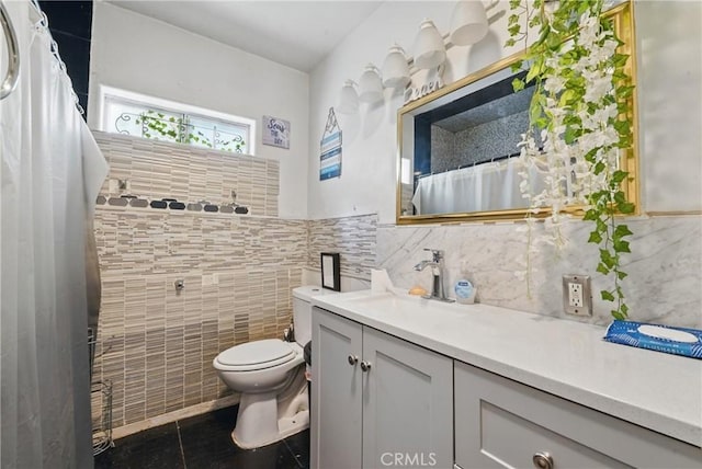 12737 Cometa Ave, San Fernando, CA 91340 - bathroom with tile walls, vanity, tile patterned floors, toilet, and a shower with shower curtain
