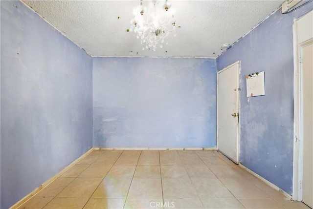 12737 Cometa Ave, San Fernando, CA 91340 - tiled spare room featuring a textured ceiling, a chandelier, and baseboards