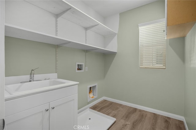3170 E Painted Crescent St, Ontario, CA 91762 - laundry room with hookup for a washing machine, a sink, wood finished floors, and baseboards