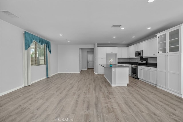 3170 E Painted Crescent St, Ontario, CA 91762 - kitchen featuring stainless steel appliances, open floor plan, dark countertops, recessed lighting, and a sink