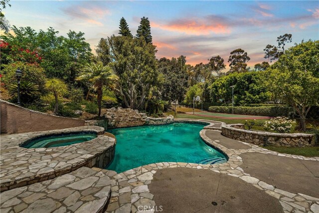 26021 Flintlock Ln, Laguna Hills, CA 92653 - outdoor pool with an in-ground hot tub and view of wooded area