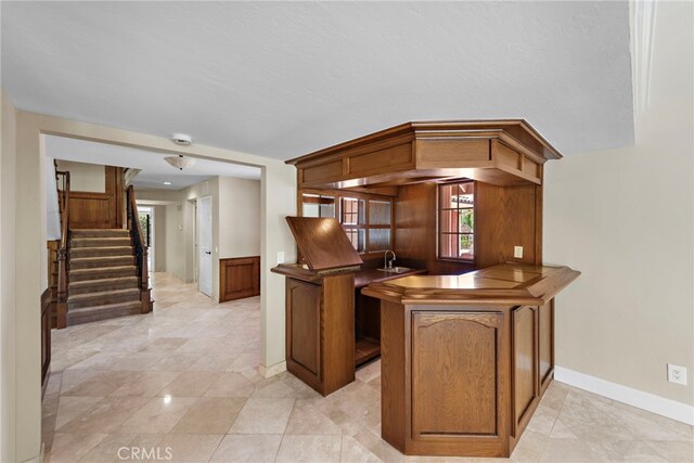 26021 Flintlock Ln, Laguna Hills, CA 92653 - kitchen featuring baseboards, a sink, dark countertops, and light tile patterned floors