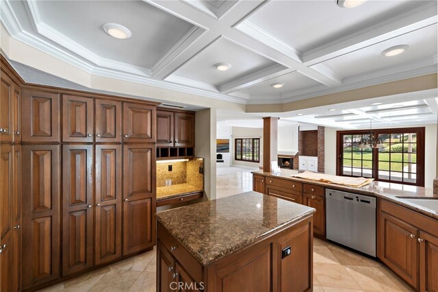 26021 Flintlock Ln, Laguna Hills, CA 92653 - kitchen with stainless steel dishwasher, coffered ceiling, a center island, dark stone countertops, and beamed ceiling