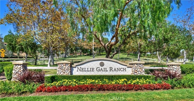 26021 Flintlock Ln, Laguna Hills, CA 92653 - community sign featuring view of wooded area