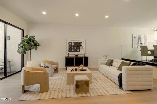 10720 Ohio Ave Unit 5, Los Angeles, CA 90024 - living room featuring wood finished floors, recessed lighting, and a chandelier