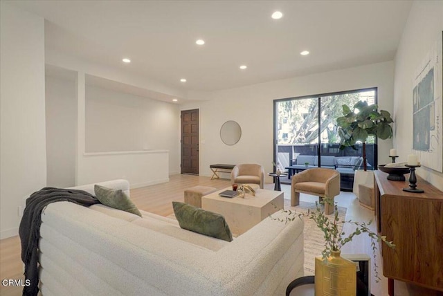 10720 Ohio Ave Unit 5, Los Angeles, CA 90024 - living area with recessed lighting, baseboards, and light wood finished floors