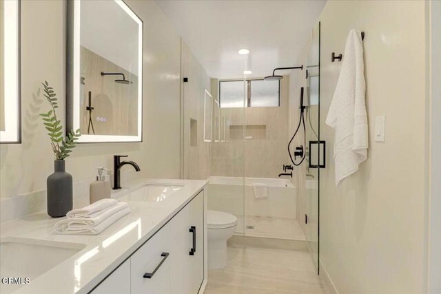 10720 Ohio Ave Unit 5, Los Angeles, CA 90024 - bathroom with a shower stall, toilet, and double vanity