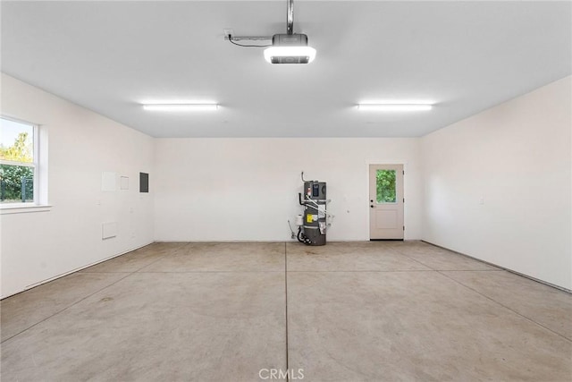 576 Roberts Rd, Paradise, CA 95969 - garage with a garage door opener and hybrid water heater