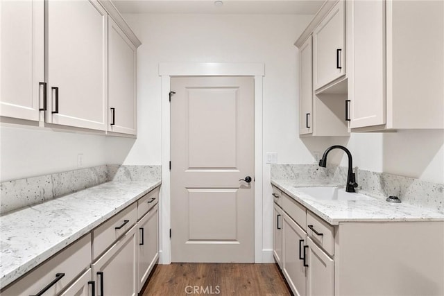 576 Roberts Rd, Paradise, CA 95969 - kitchen featuring a sink, wood finished floors, and light stone counters