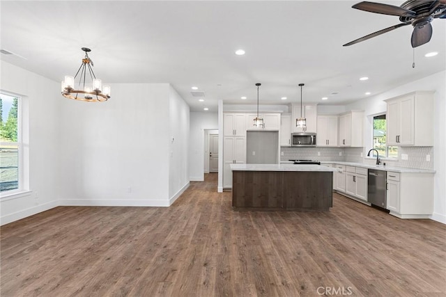 576 Roberts Rd, Paradise, CA 95969 - kitchen with appliances with stainless steel finishes, tasteful backsplash, recessed lighting, light countertops, and dark wood-style flooring