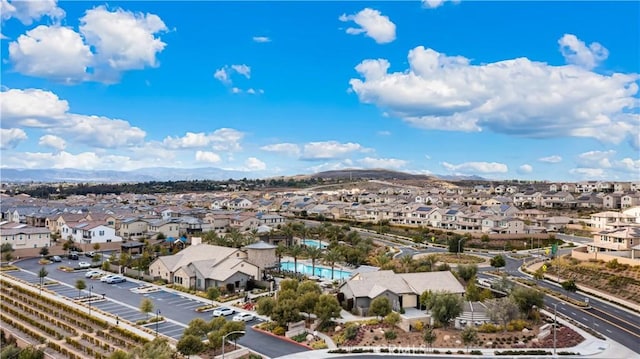 aerial perspective of suburban area with a mountainous background