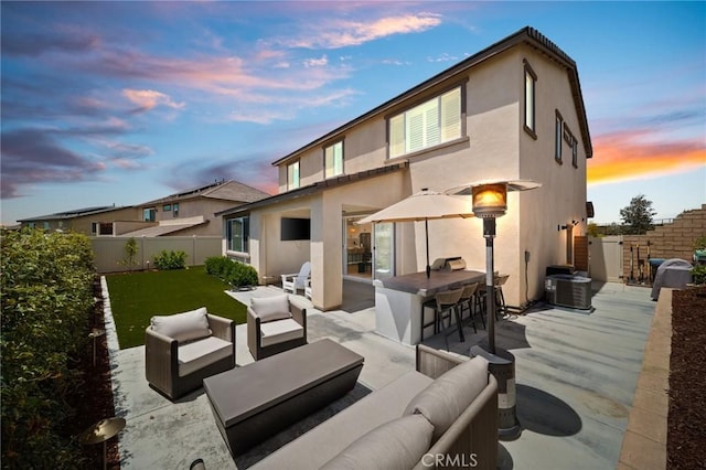 rear view of house with an outdoor hangout area, stucco siding, a patio, and cooling unit