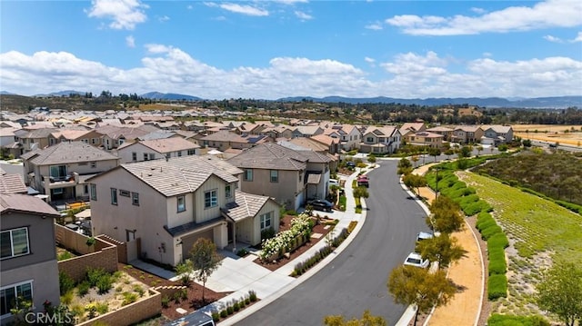 aerial perspective of suburban area with mountains