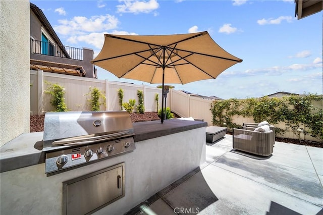 fenced backyard with a patio area
