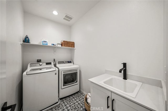 washroom featuring independent washer and dryer, baseboards, cabinet space, and recessed lighting